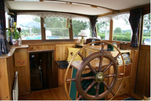 Wheelhouse looking forward.To left, stairs down to main cabin.